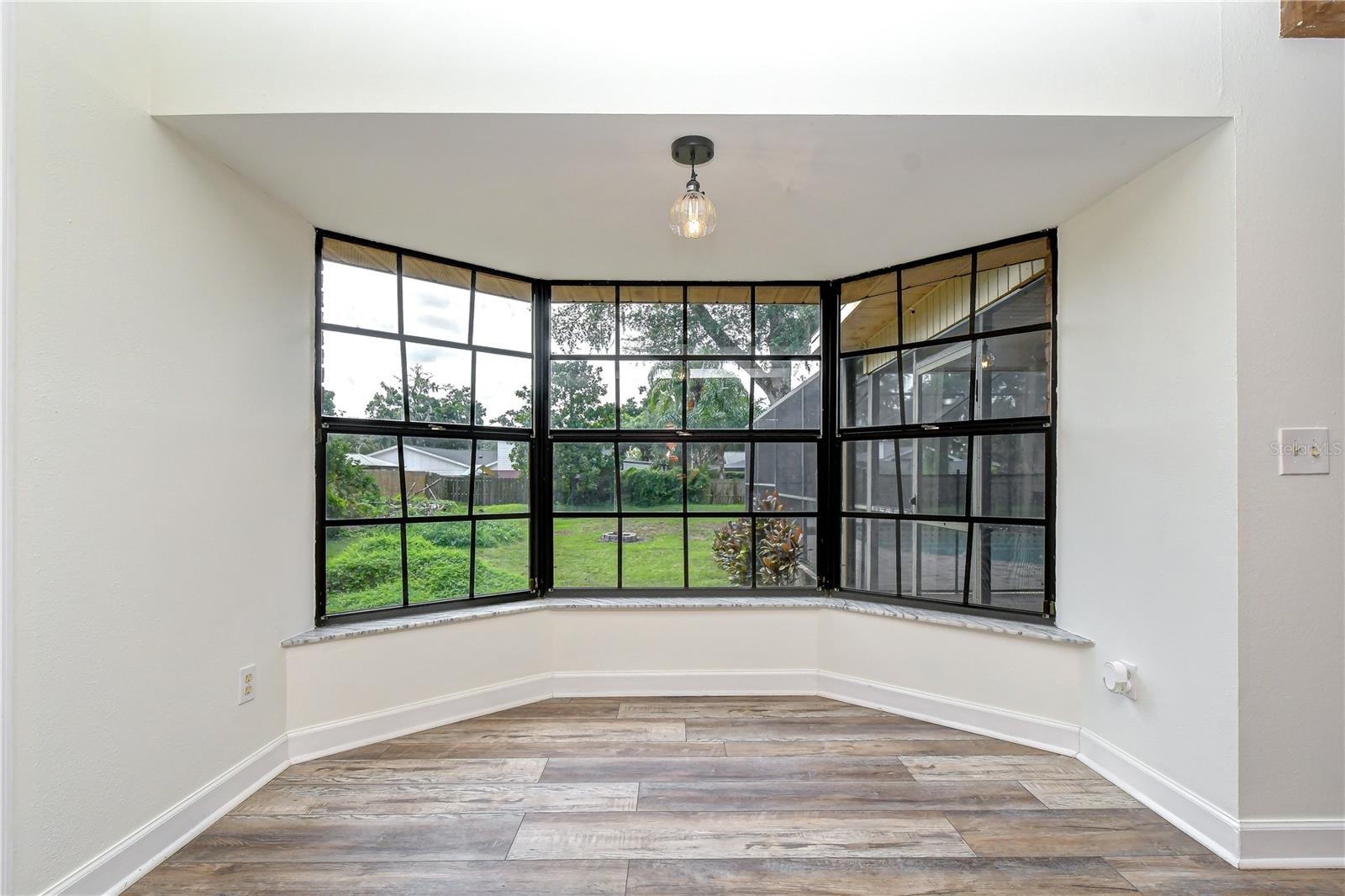 Offer peaceful backyard views and fill the breakfast nook with natural light