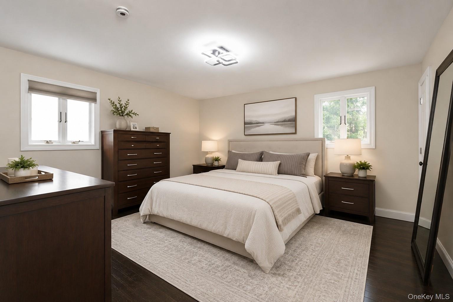 Primary bedroom virtually staged w/en suite bathroom