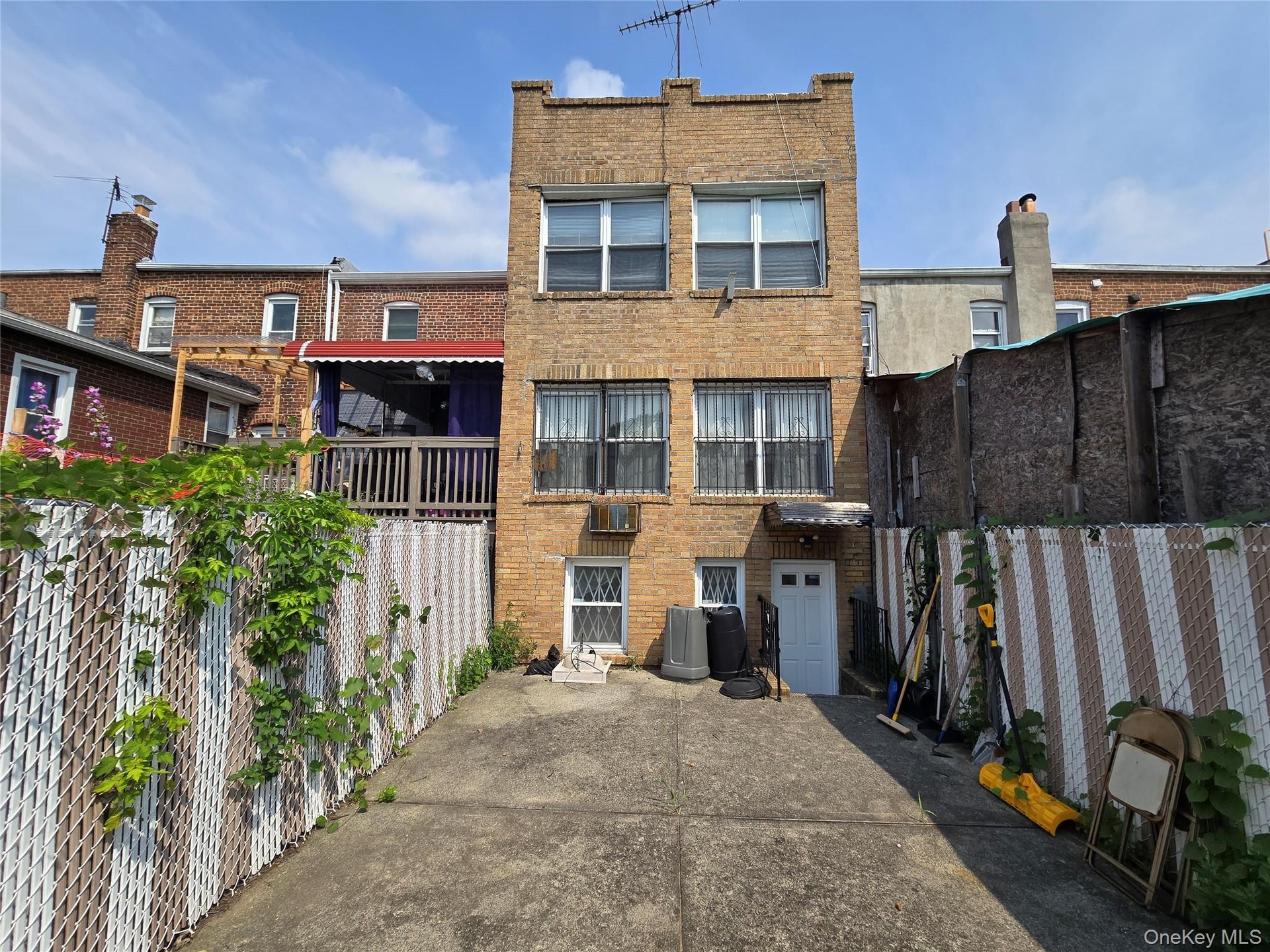 Private patio and access to shared alley for car access.