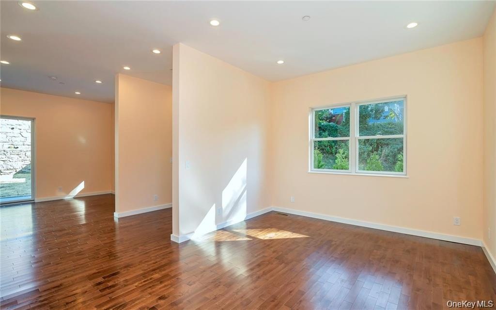 Unfurnished room featuring recessed lighting and dark wood finished floors