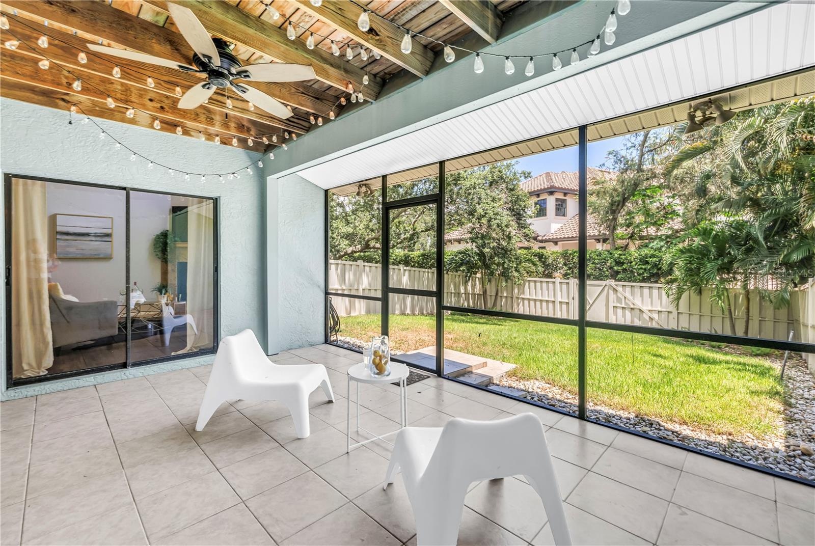 Fully Screened Back Porch accesses the fenced yard for Recreation and Pets.