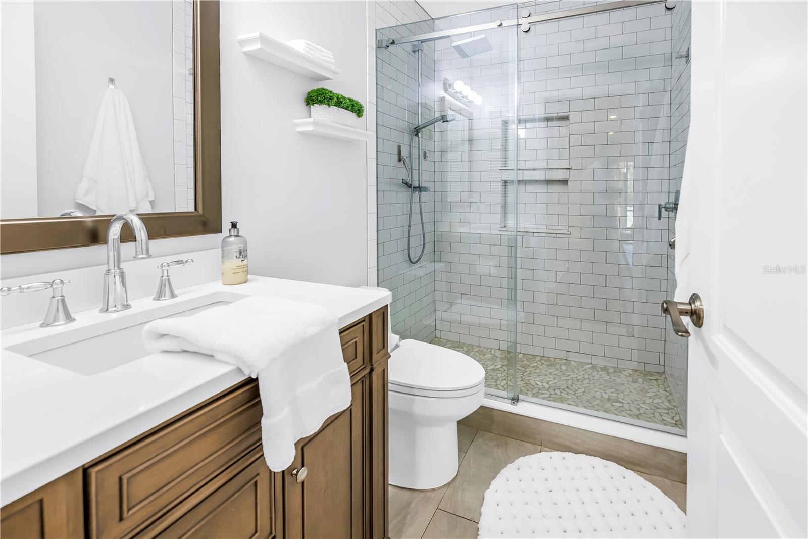 Fully Updated First Floor Full Bath.  Very nice Glass Enclosure, shower and fixtures