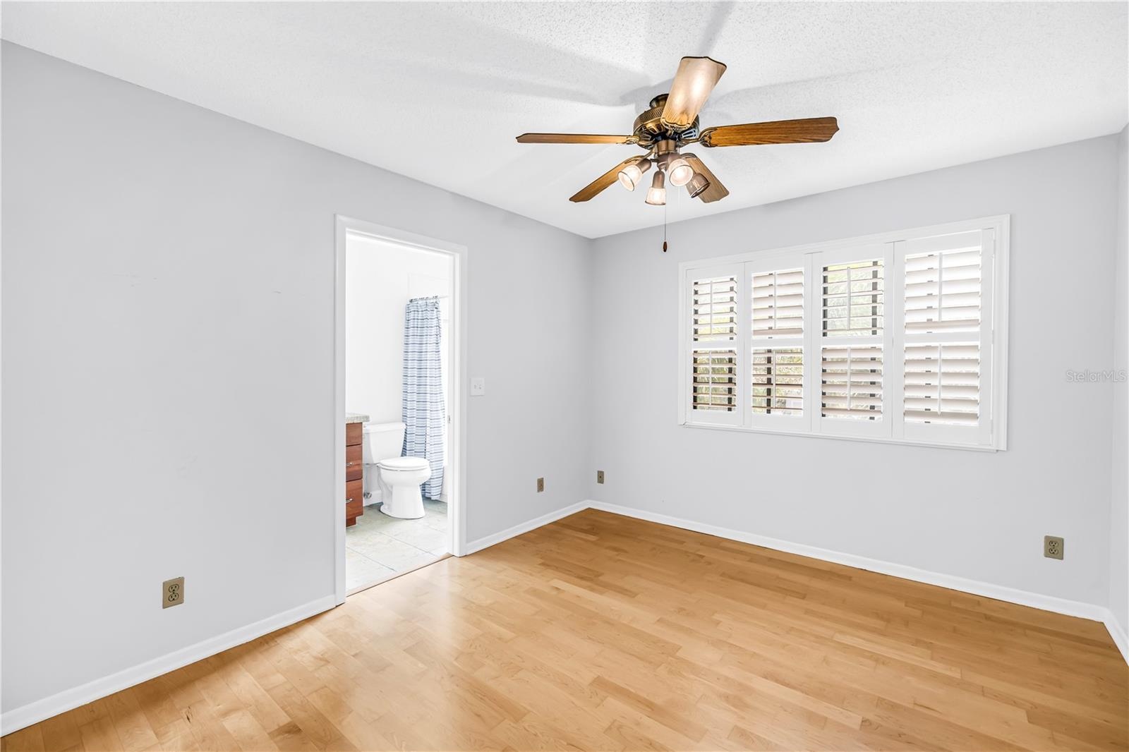 Upstairs 2nd Suite. Light hardwood flooring, nice view, plantation shutters