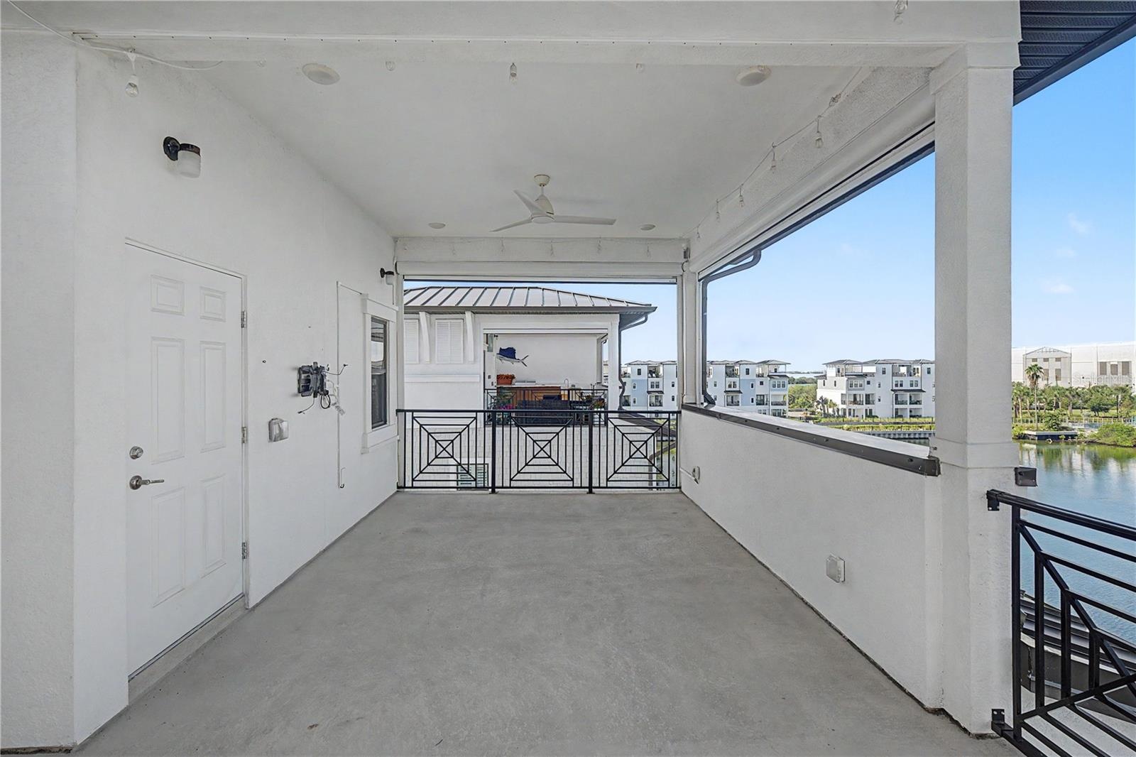 Fourth-level outdoor patio with large seating area.