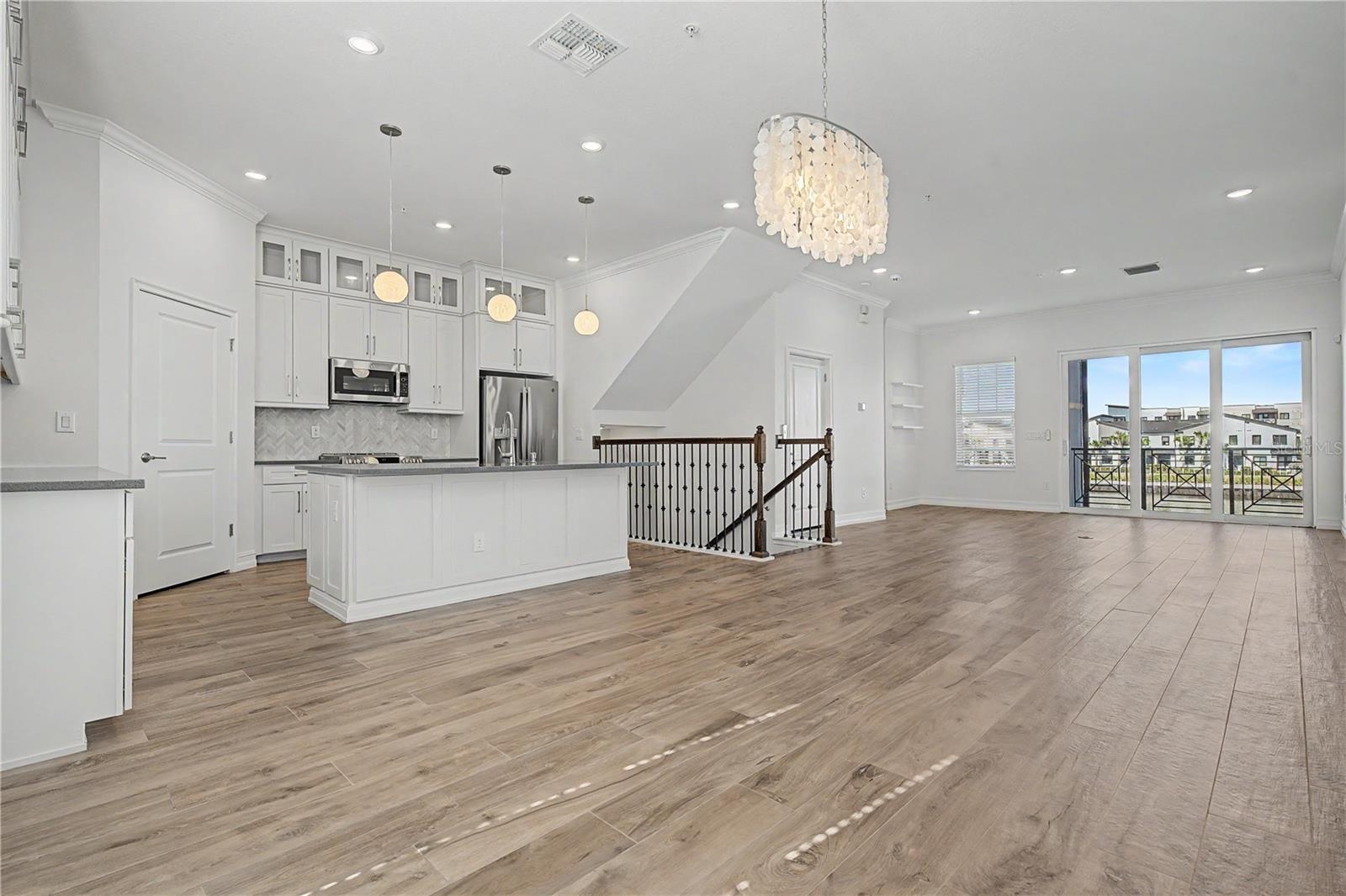 Second-level kitchen/dining  opening seamlessly to the living area.