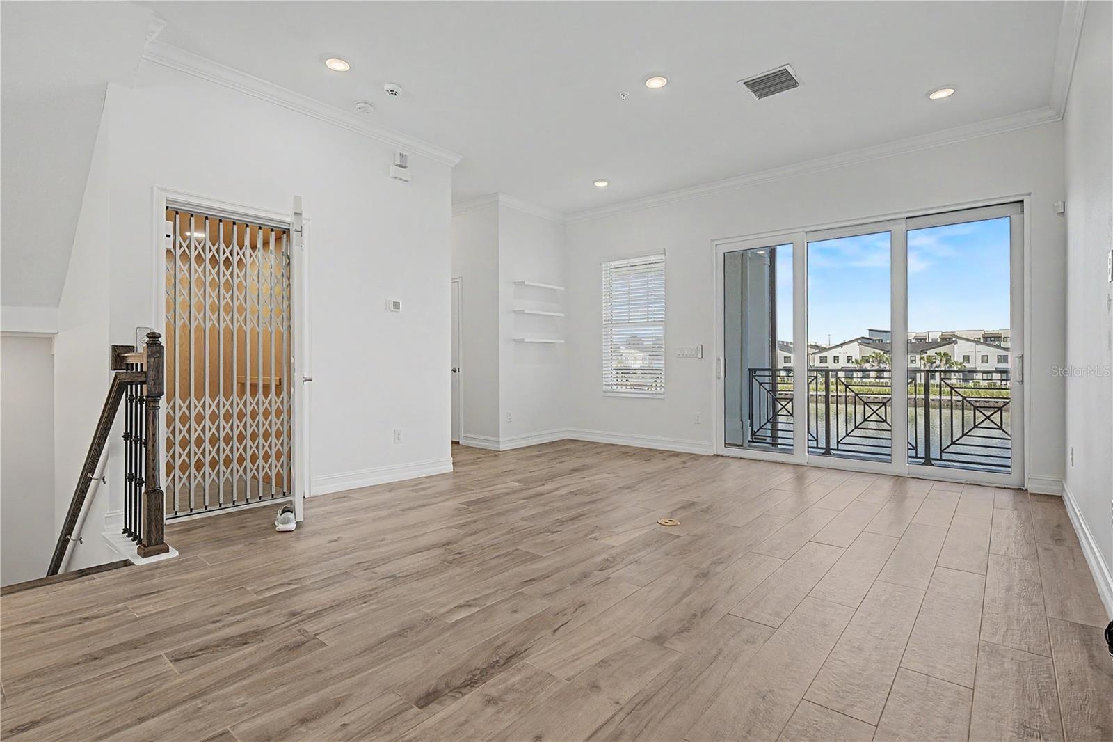 Second-level living area-elevator-doors to second floor balcony