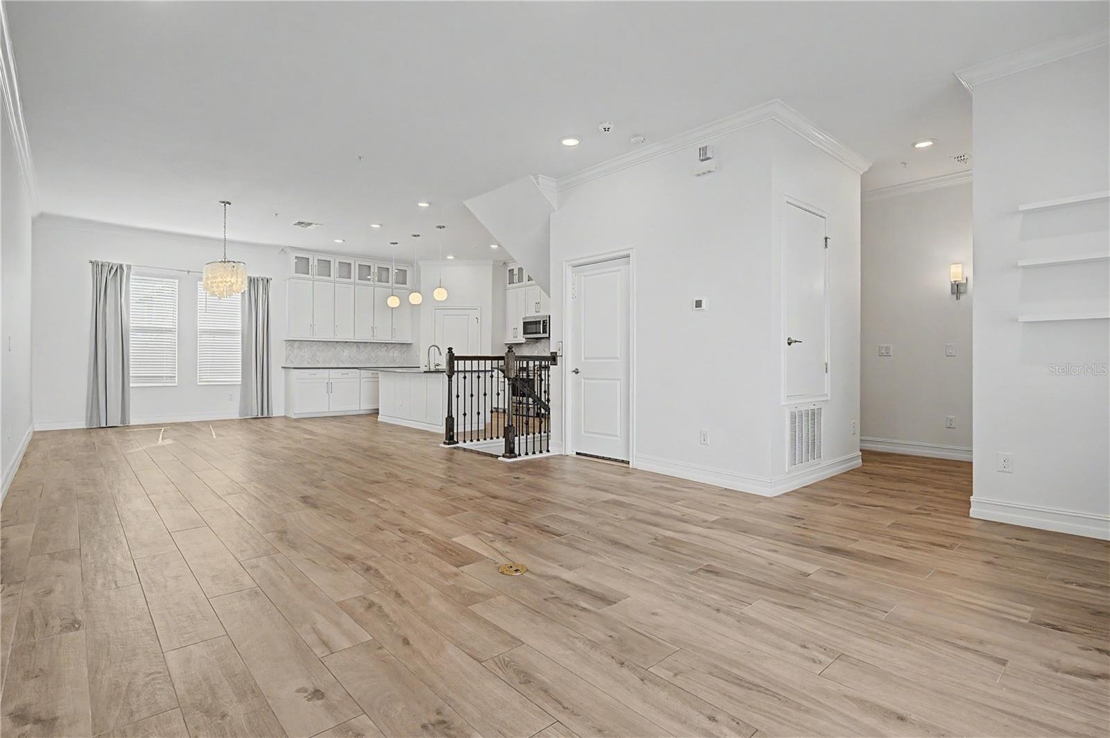 Second-level view from the living area, highlighting the open-concept layout.