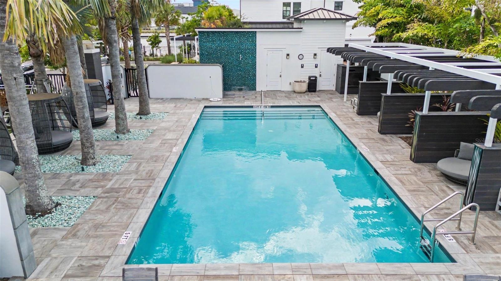 Inviting community pool, perfect for relaxing and unwinding in your downtime.