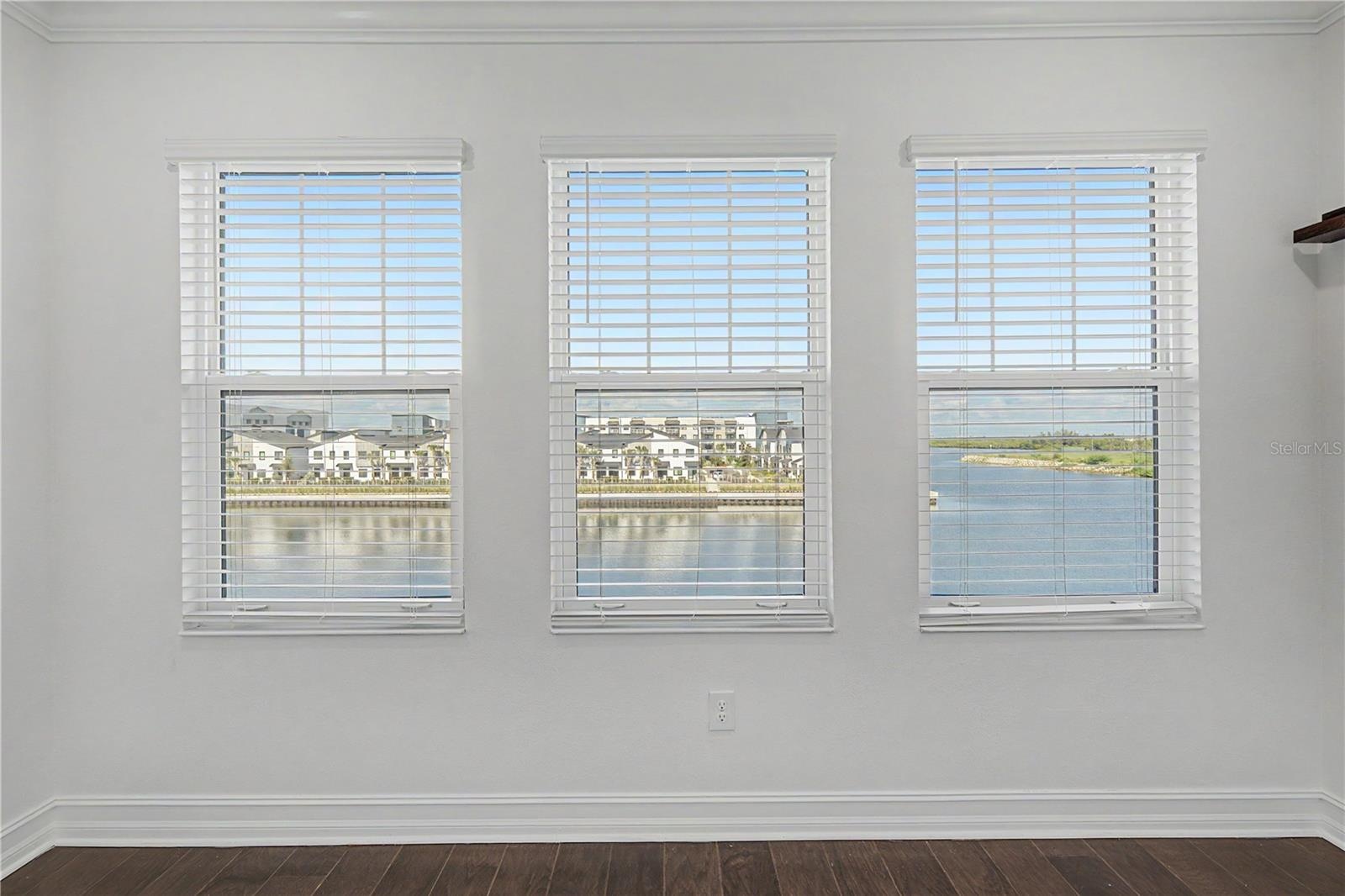 Third-level primary bedroom offering  beautiful water views.