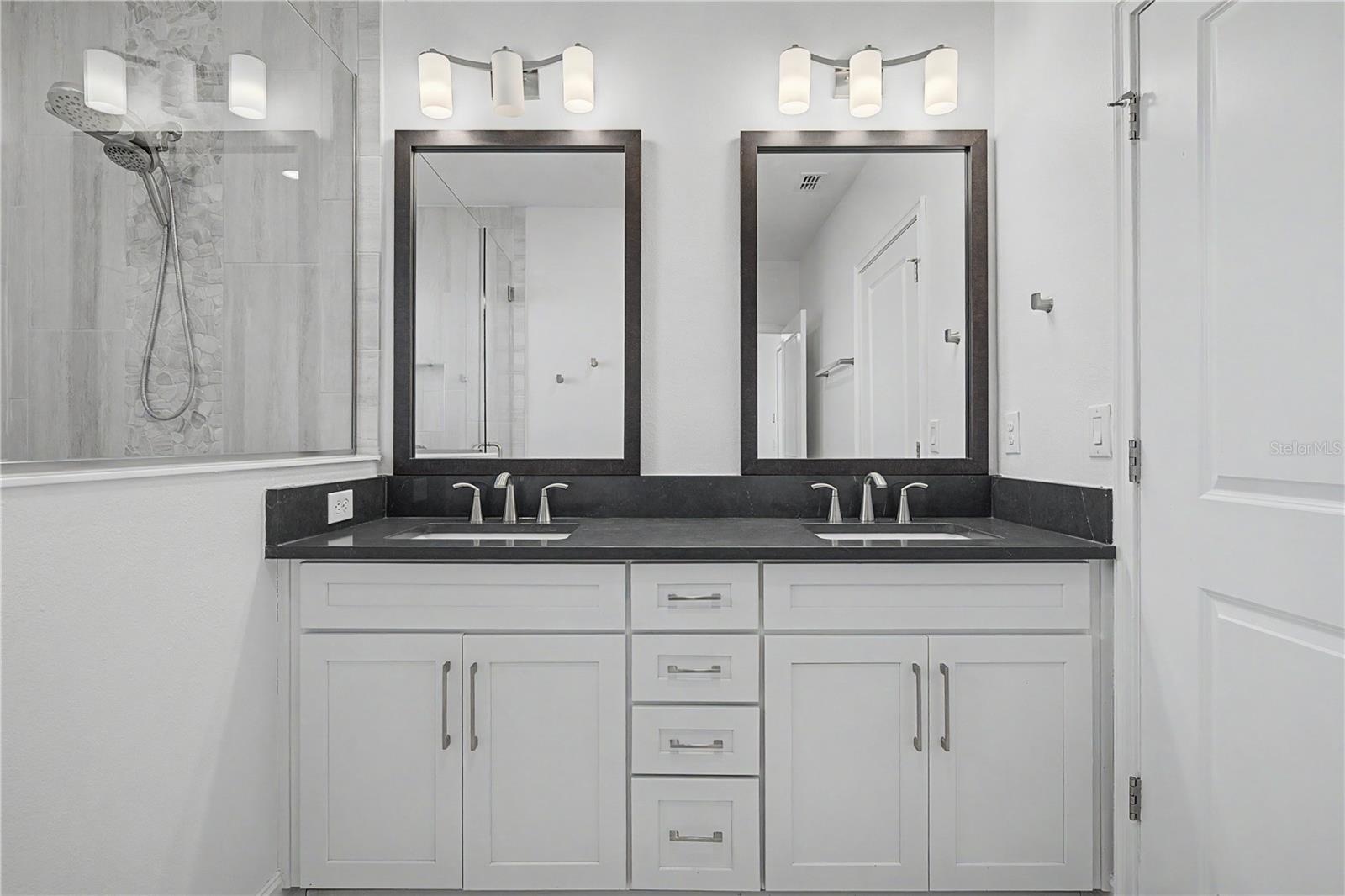 Third-level, master bath with double sinks.