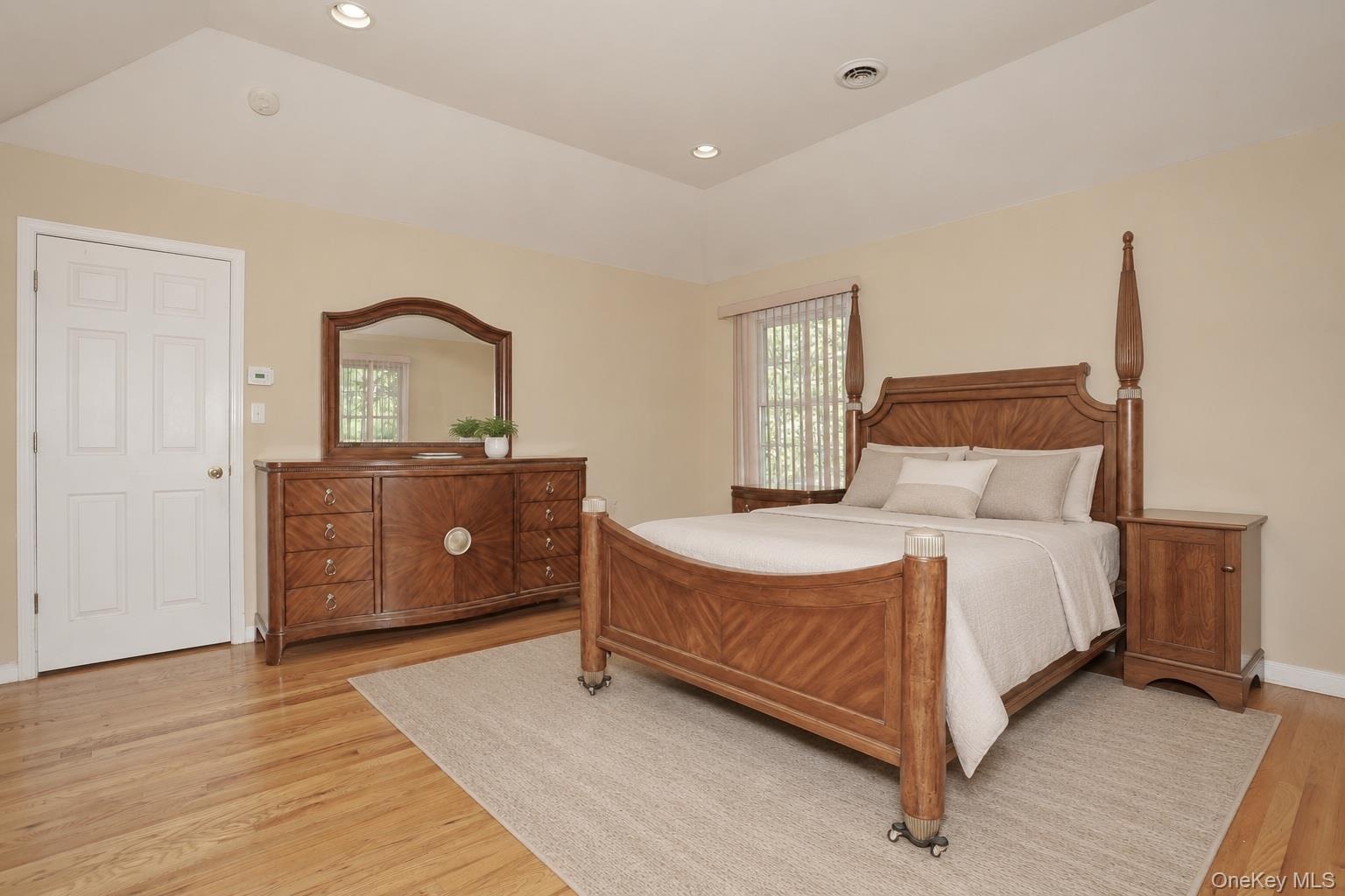 Primary Bedroom with vaulted ceiling