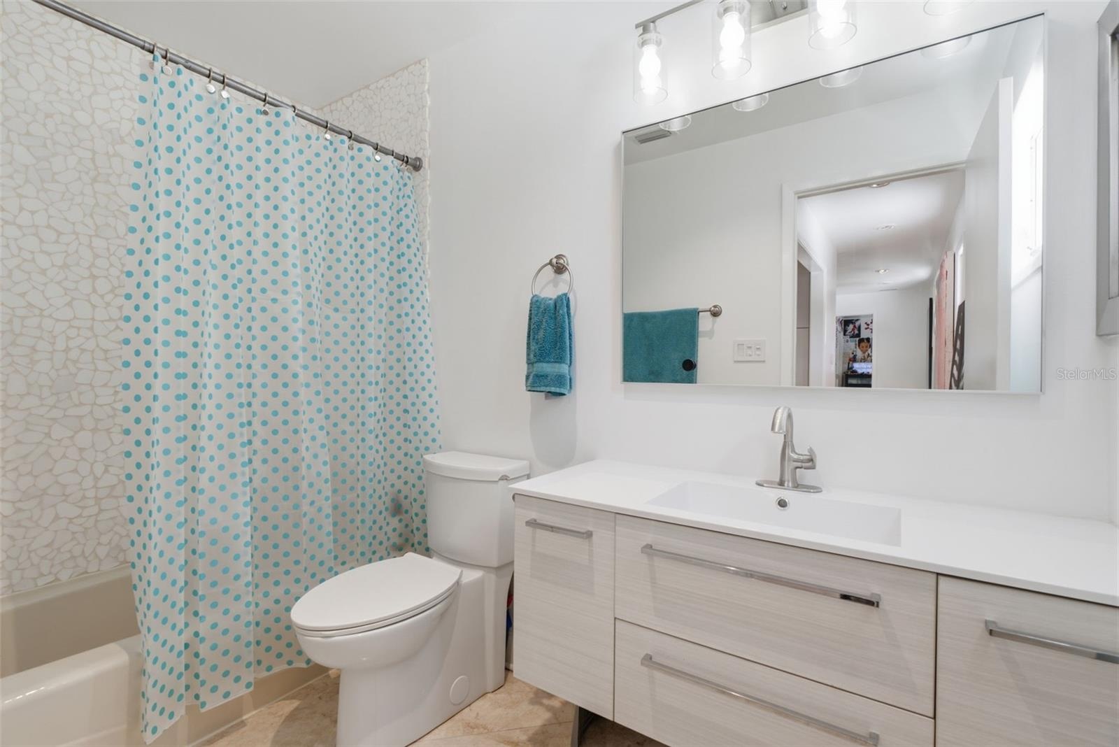 2nd floor bathroom has bathtub with shower
