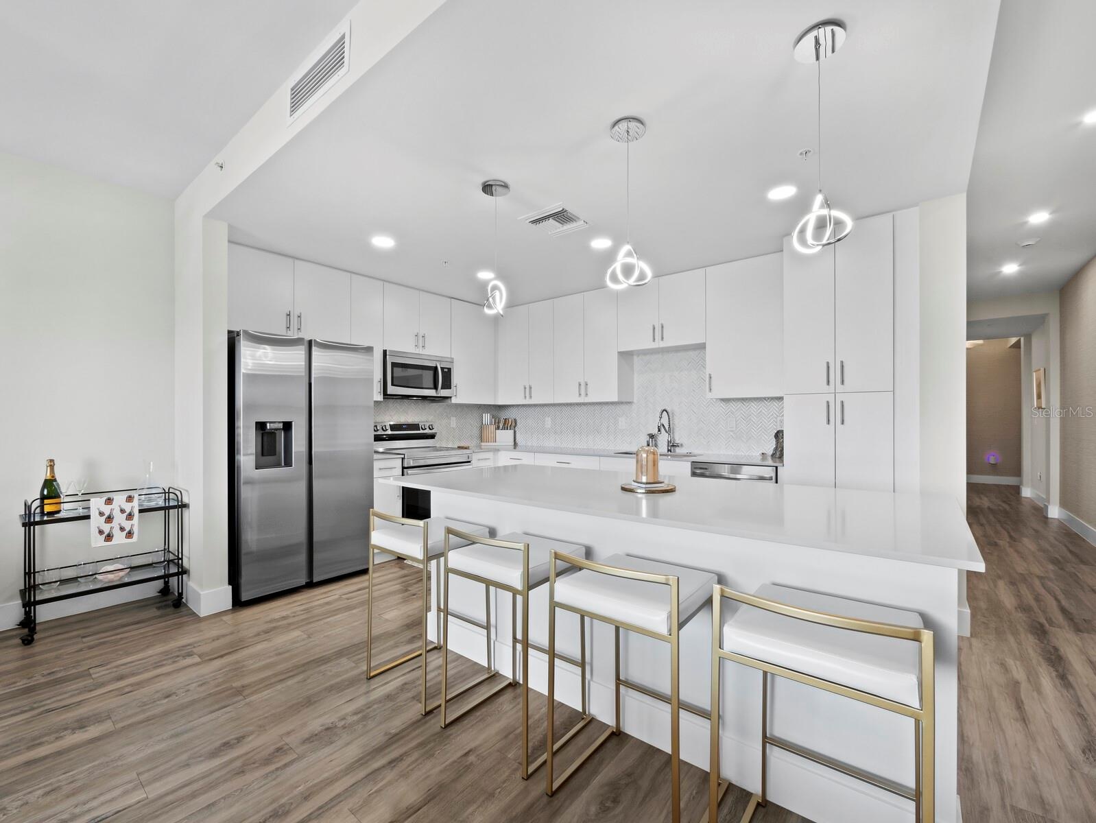 Large kitchen island with quartz counters