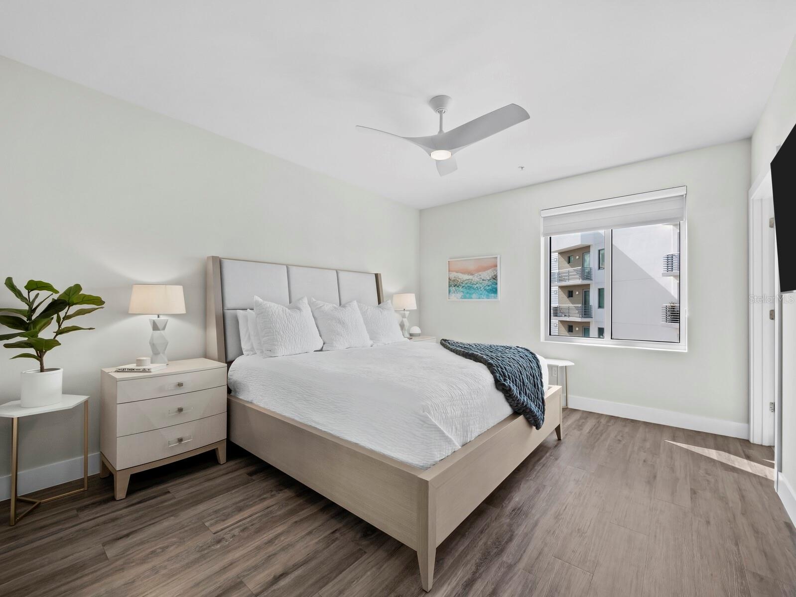 Spacious primary bedroom with plenty of natural light and room for king bed