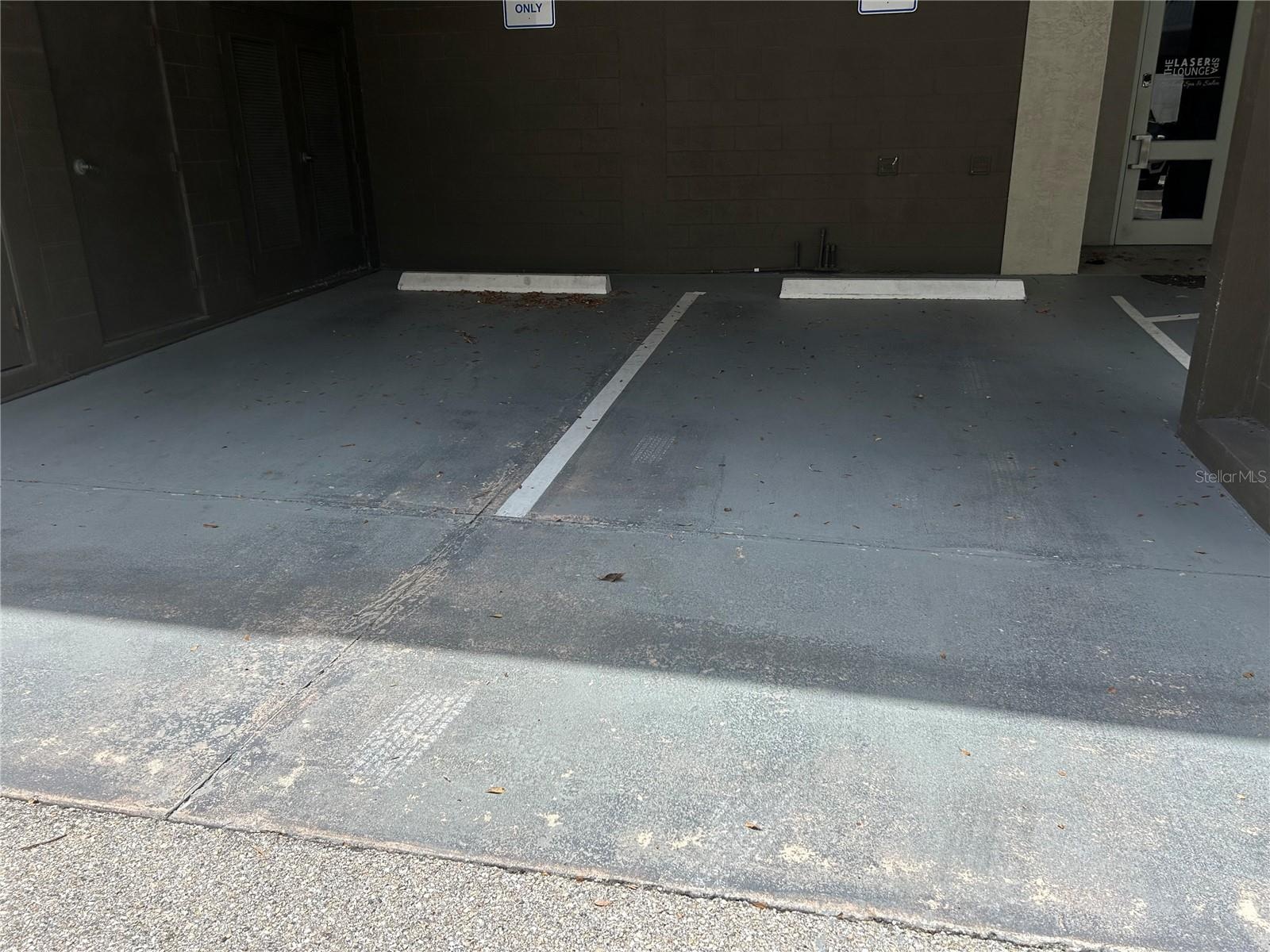 2 covered assigned parking spaces
