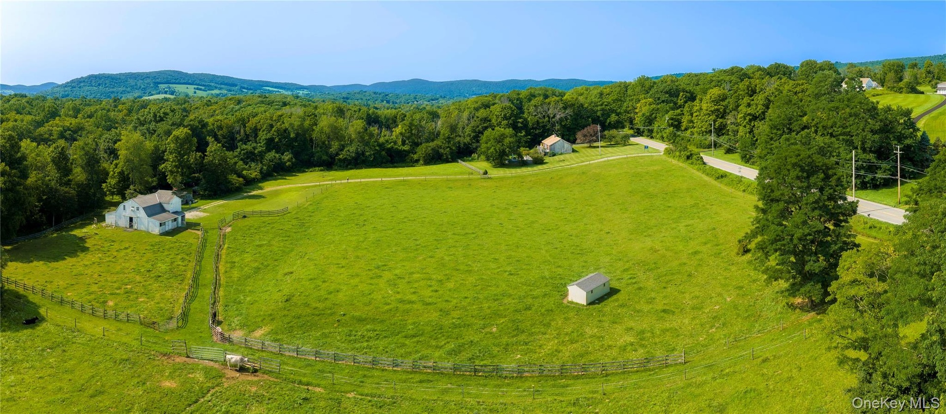 Established working horse farm featuring approximately 14 cleared acres.