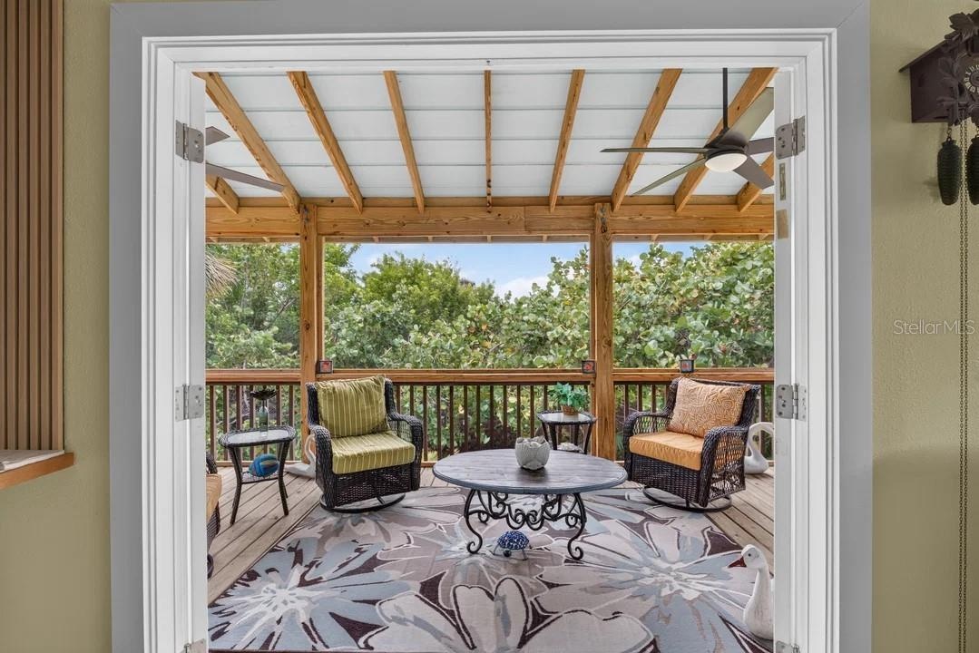 French doors leading out to the screened in porch