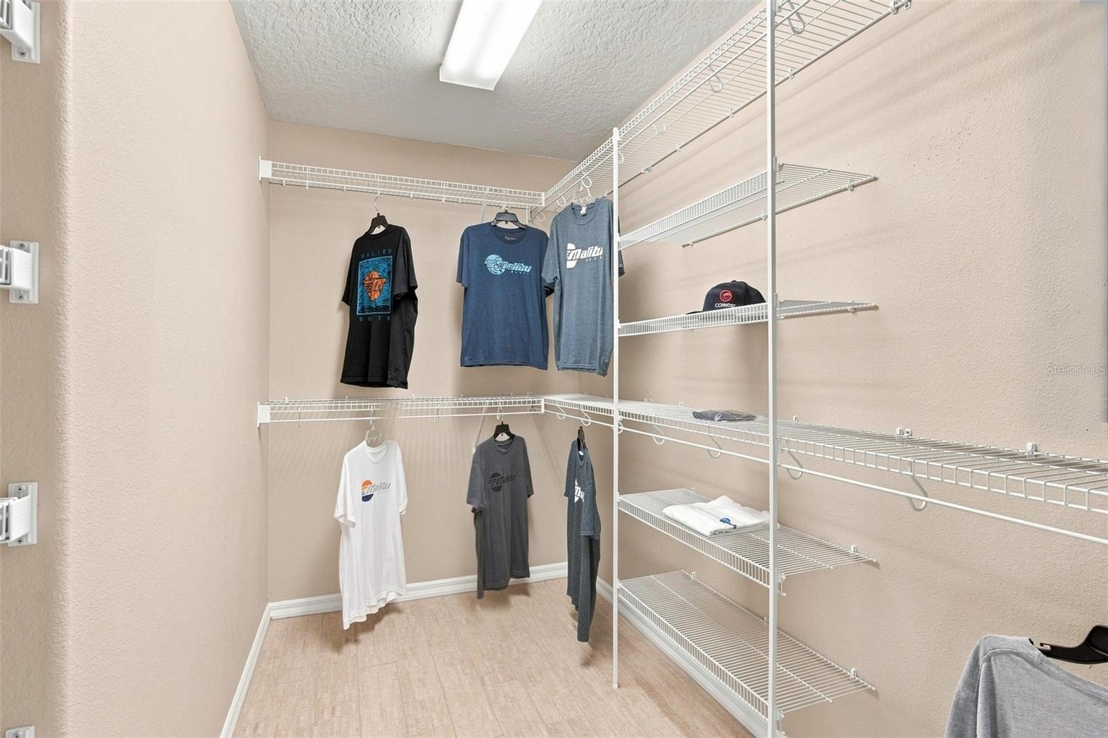Primary Bedroom walk in closet