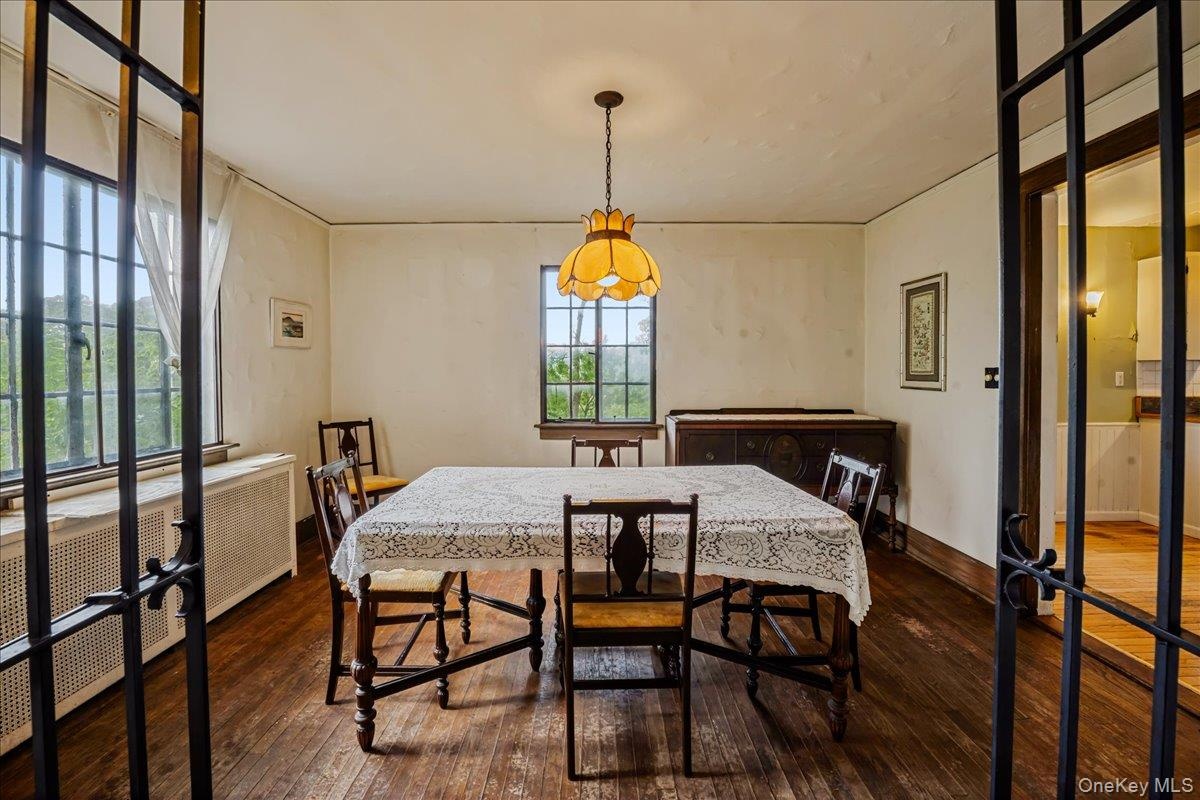 Dining room off living room with hardwood floors