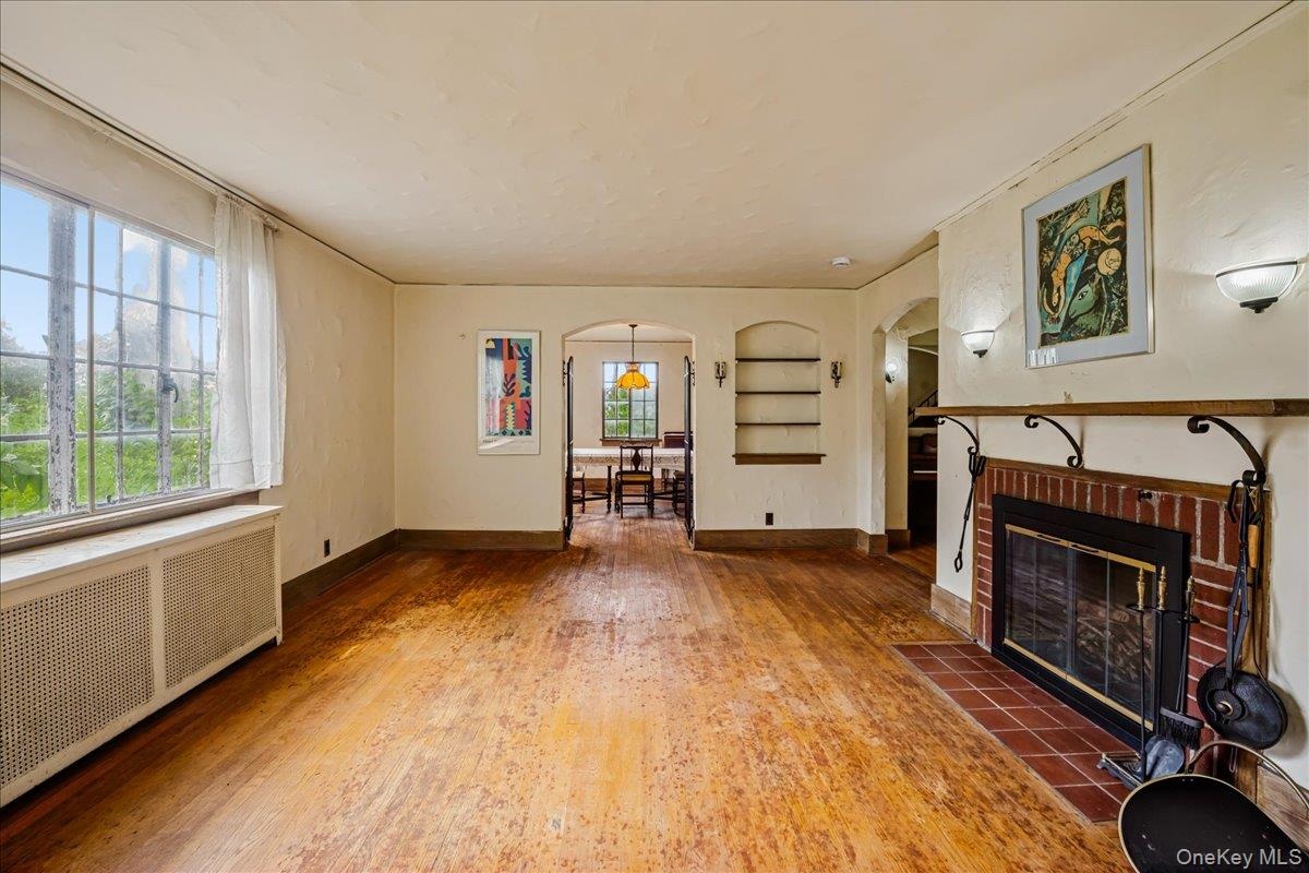 Living Room with wood burning fireplace and hardwood floors