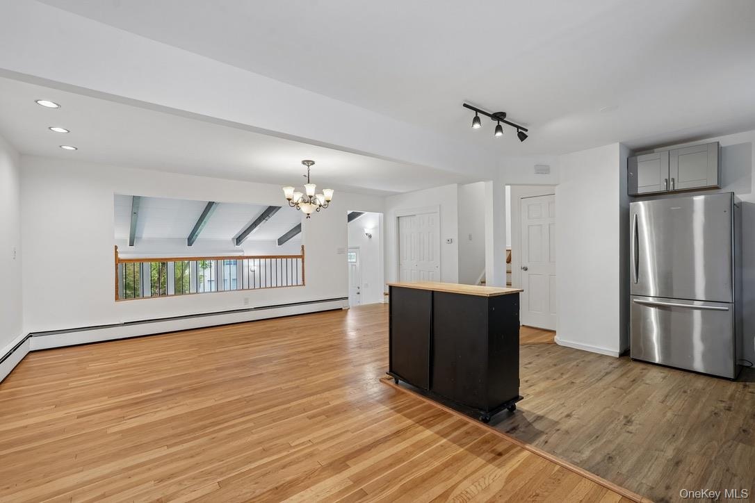 Dining room with view of living room and island