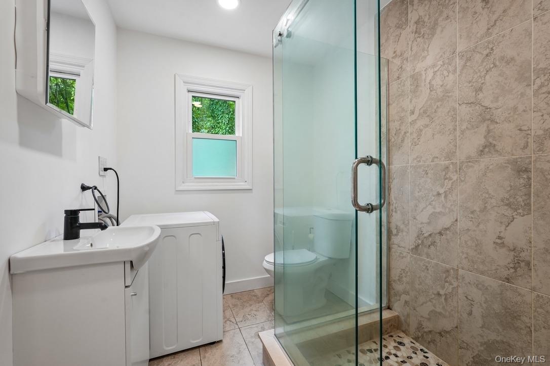 Main bathroom with washer/dryer combo unit