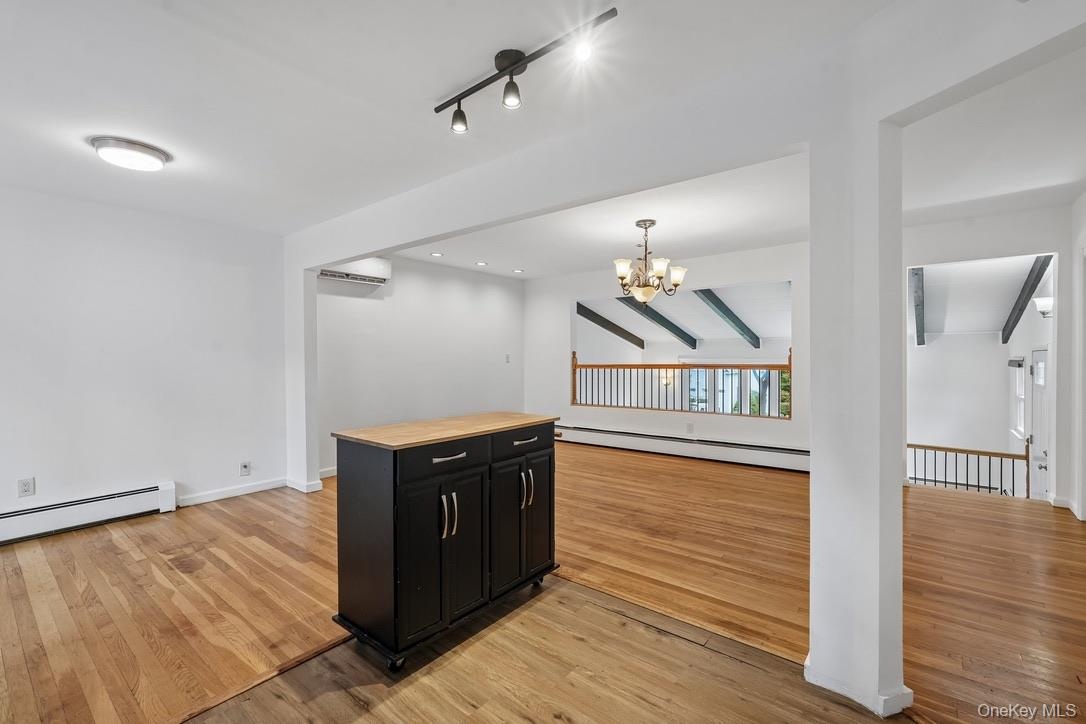 Movable island with view of dining area and living room,