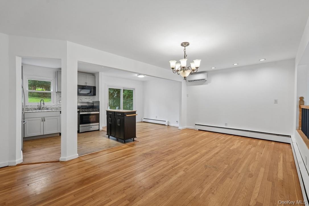 Living room with view of dining room