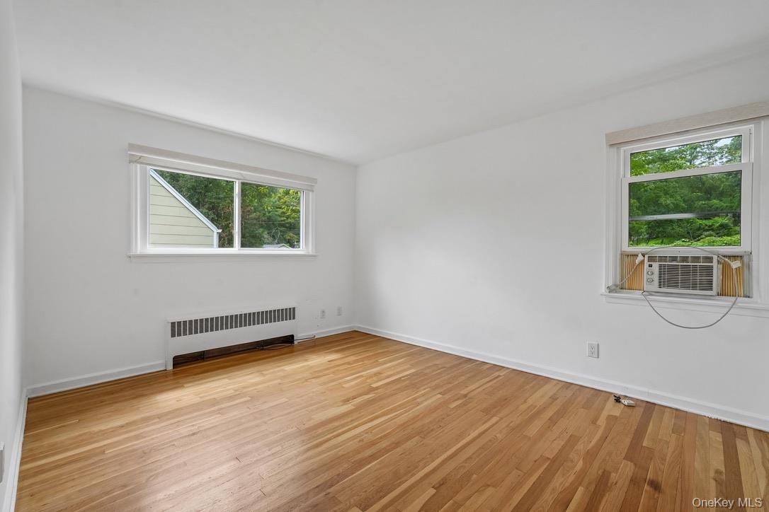 Primary bedroom with windows for natural light