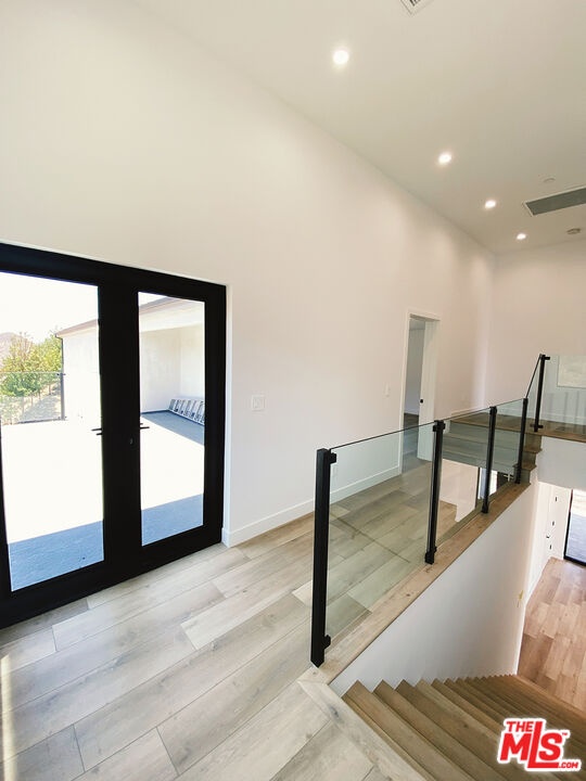 glass staircase on upper level