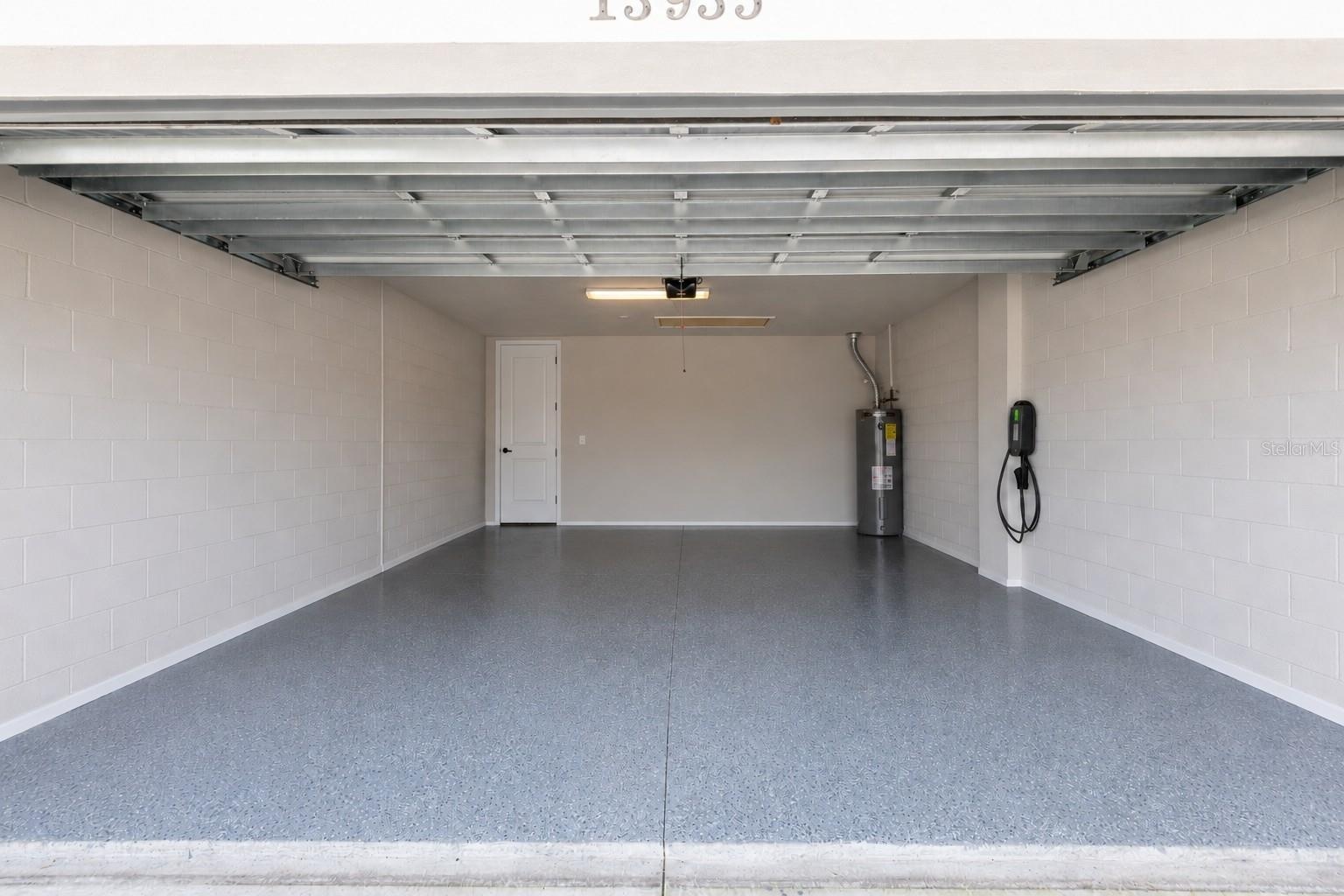 Garage items virtually removed.  The garage has a gas hot water heater and a 240 charger for an electric vehicle.