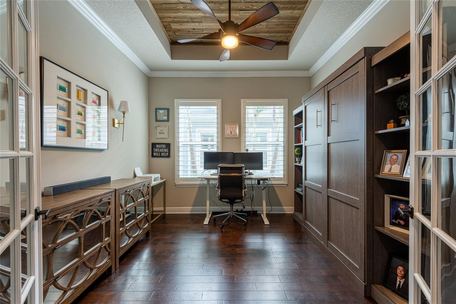 Office with a Murphy Bed and beautiful wood inlay ceiling.