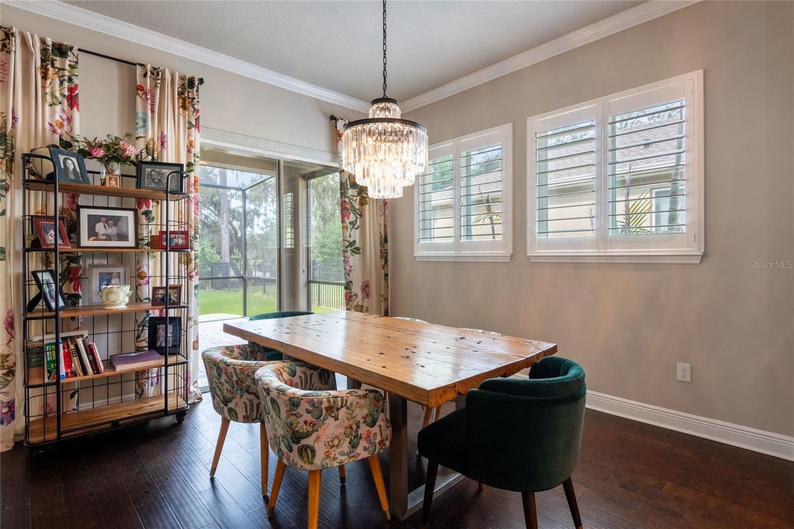 Dining area with sliders leading to the screened lanai.
