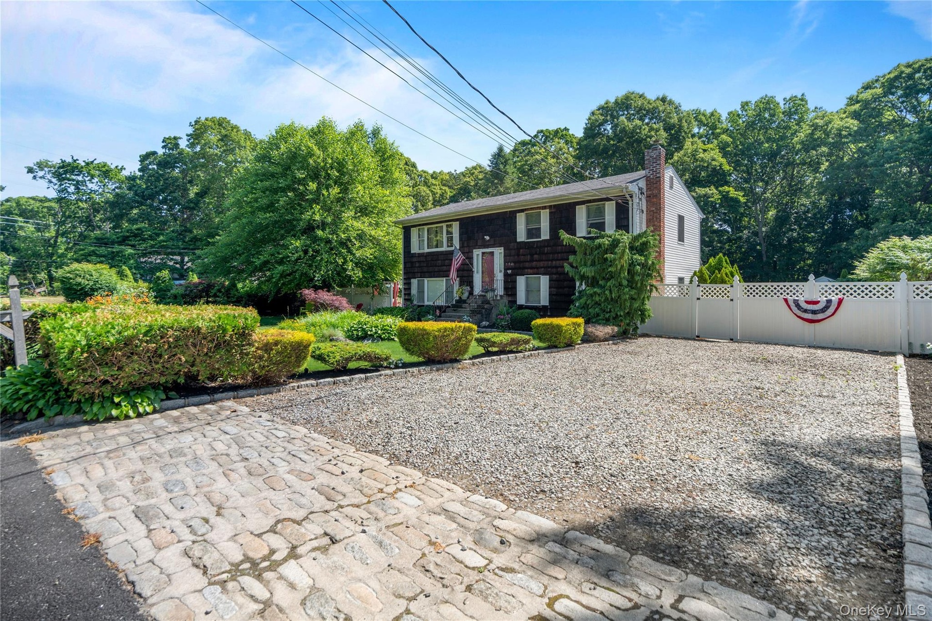 Expanded driveway accommodates up to four cars.