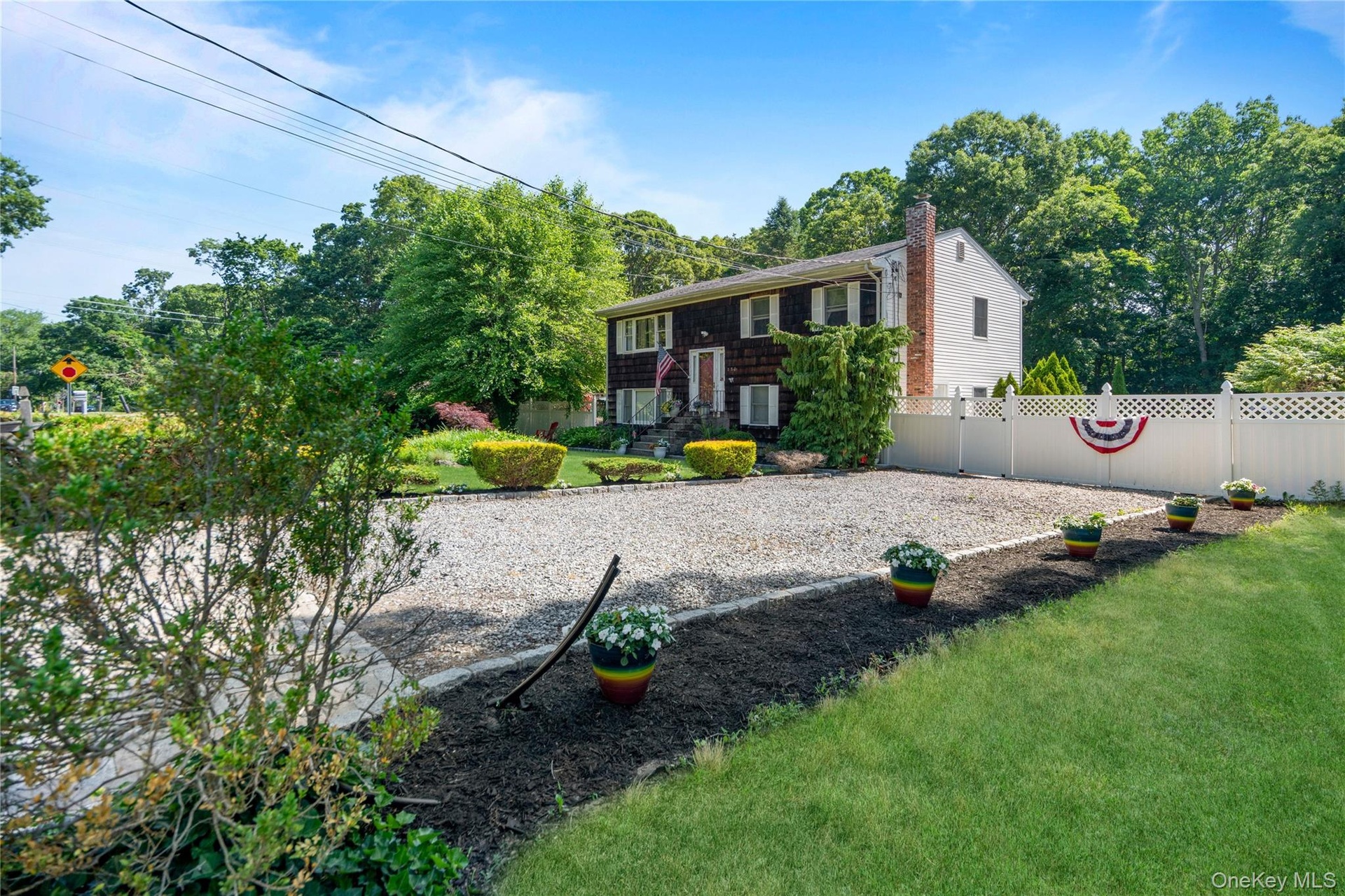 Expanded driveway accommodates up to four cars.