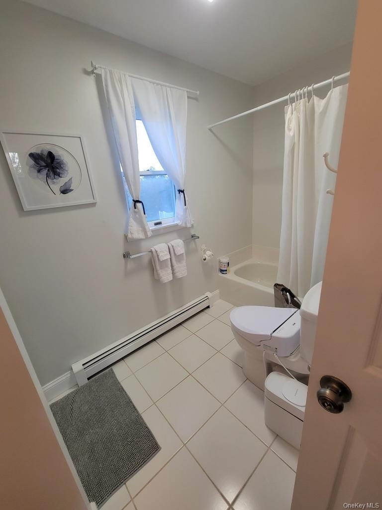 Bathroom with tub and separate shower.