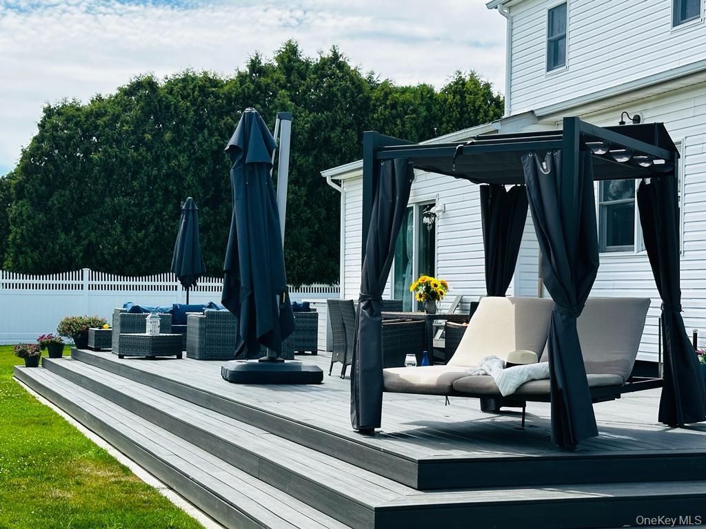 Outdoor deck featuring assigned living areas for lounging, dinners and relaxing.