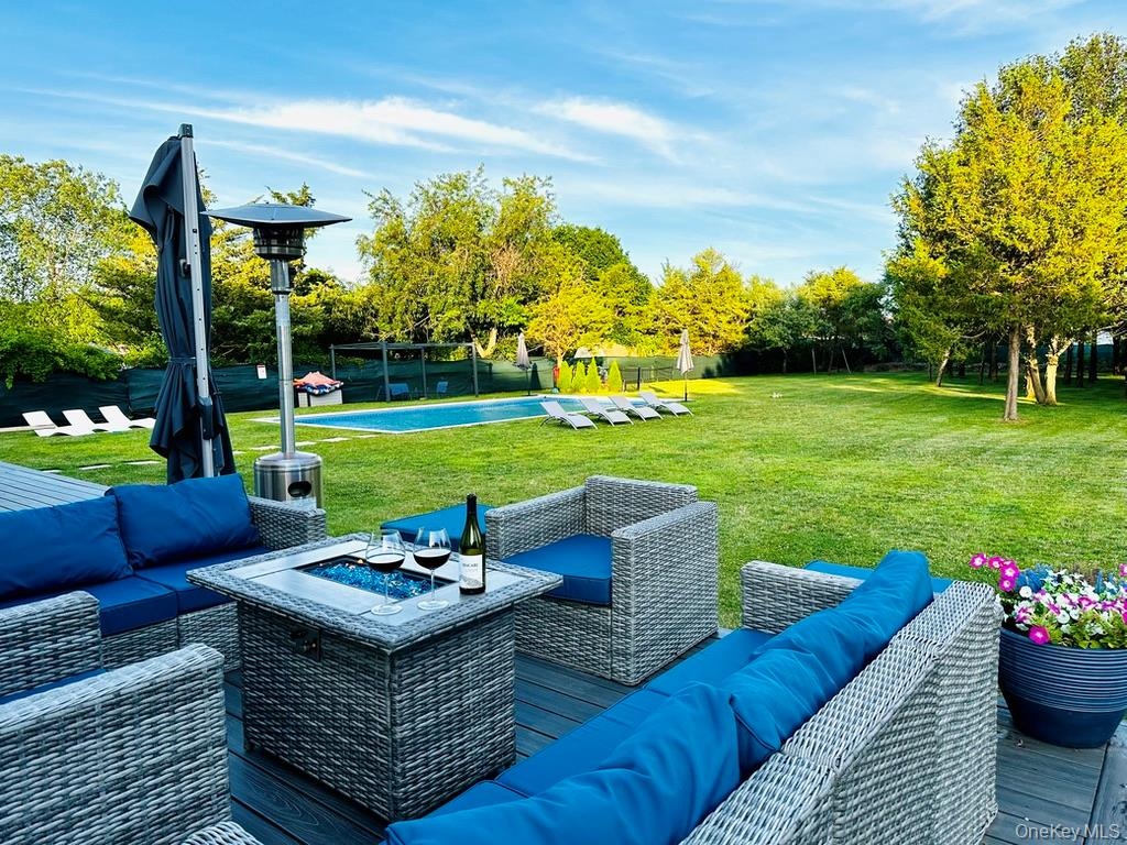 Large deck with assigned sitting areas for lounging, eating and pool relax