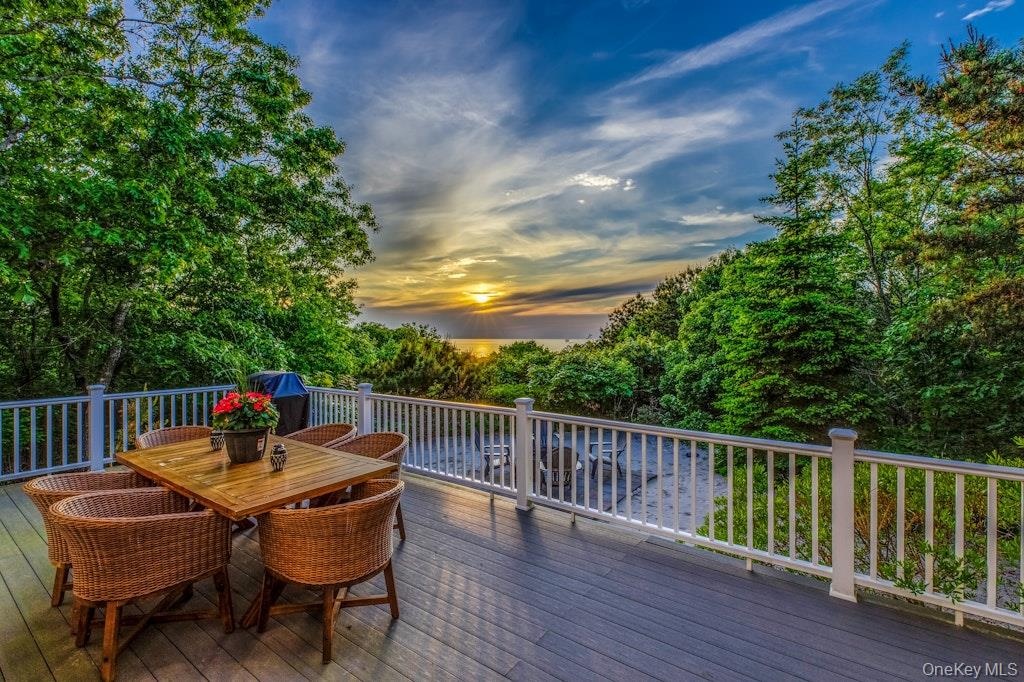 Deck with gorgeous sunset and water views