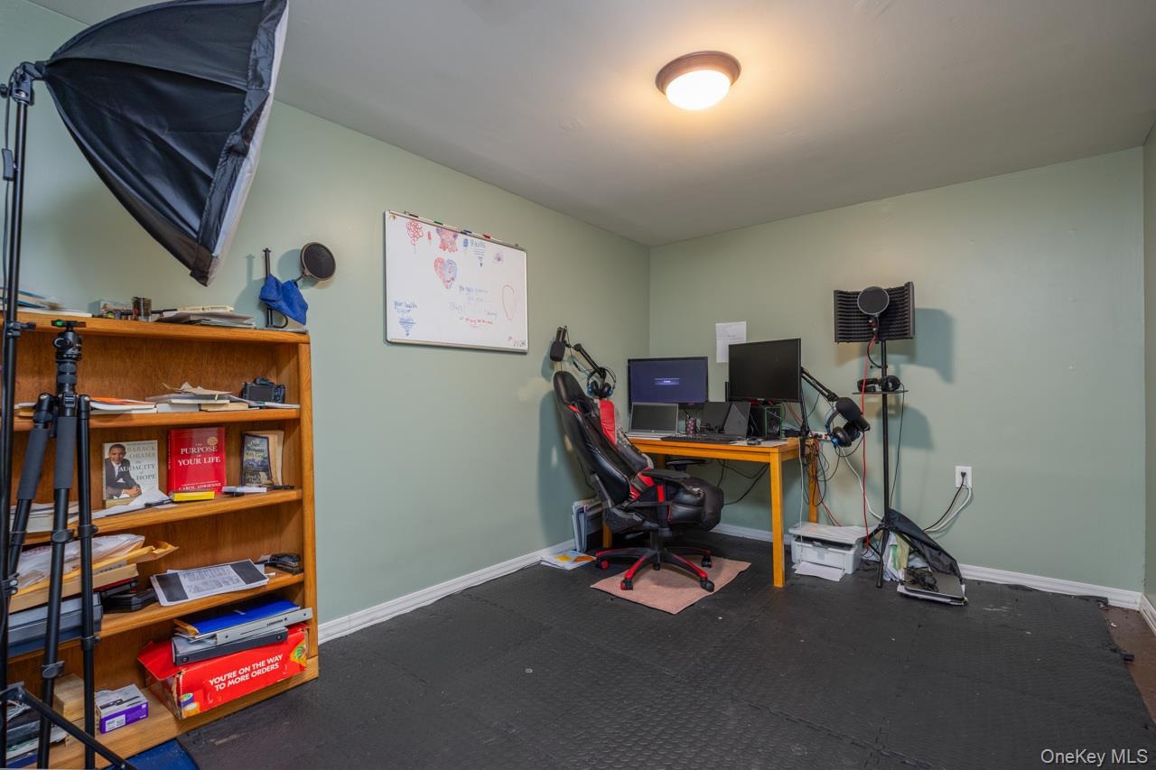 Additional finished room currently used for social media and had been a weight room.