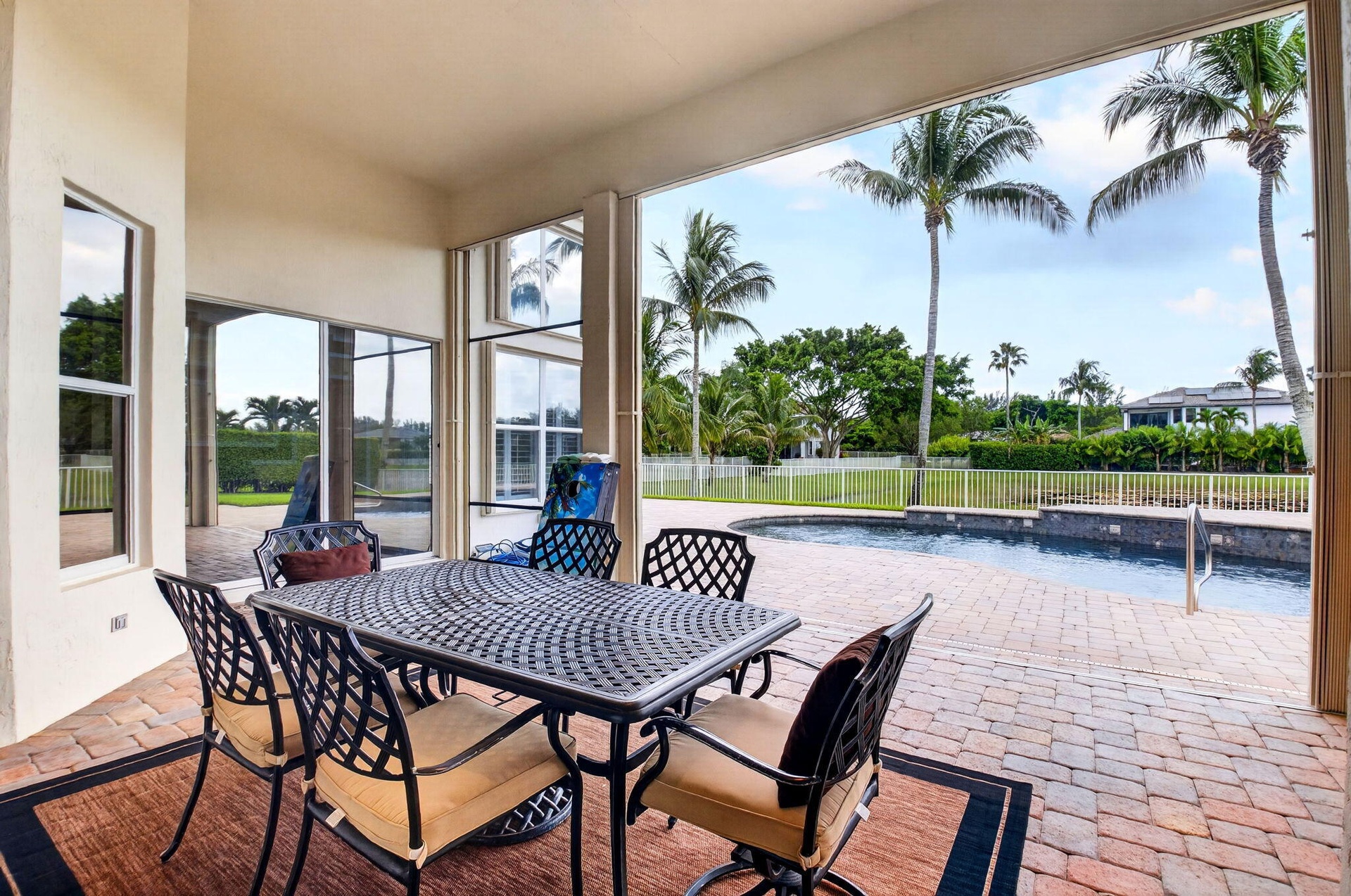 Covered outdoor patio with a paved surface