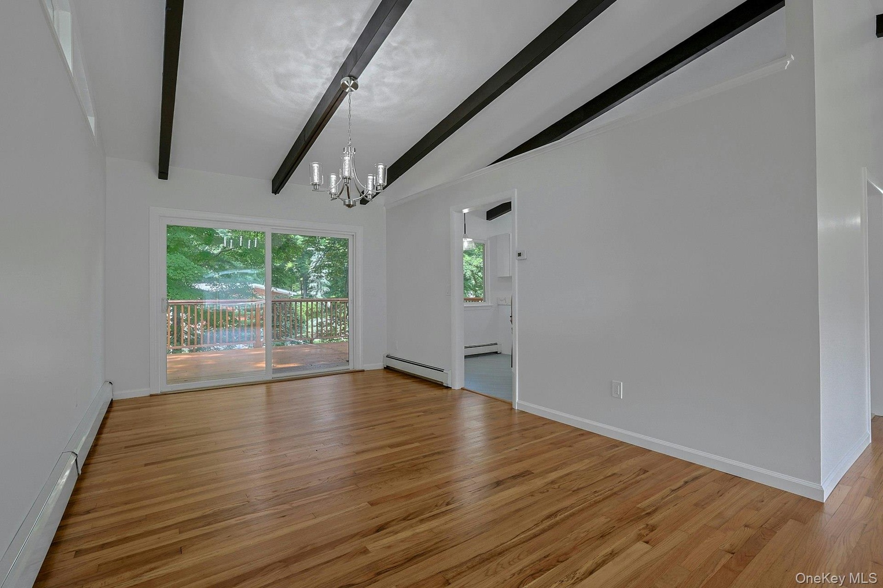Spacious dining room with sliders to the oversized deck