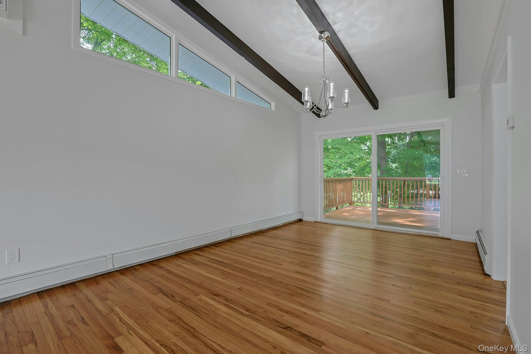 Another view of the dining room featuring the sliders to the deck