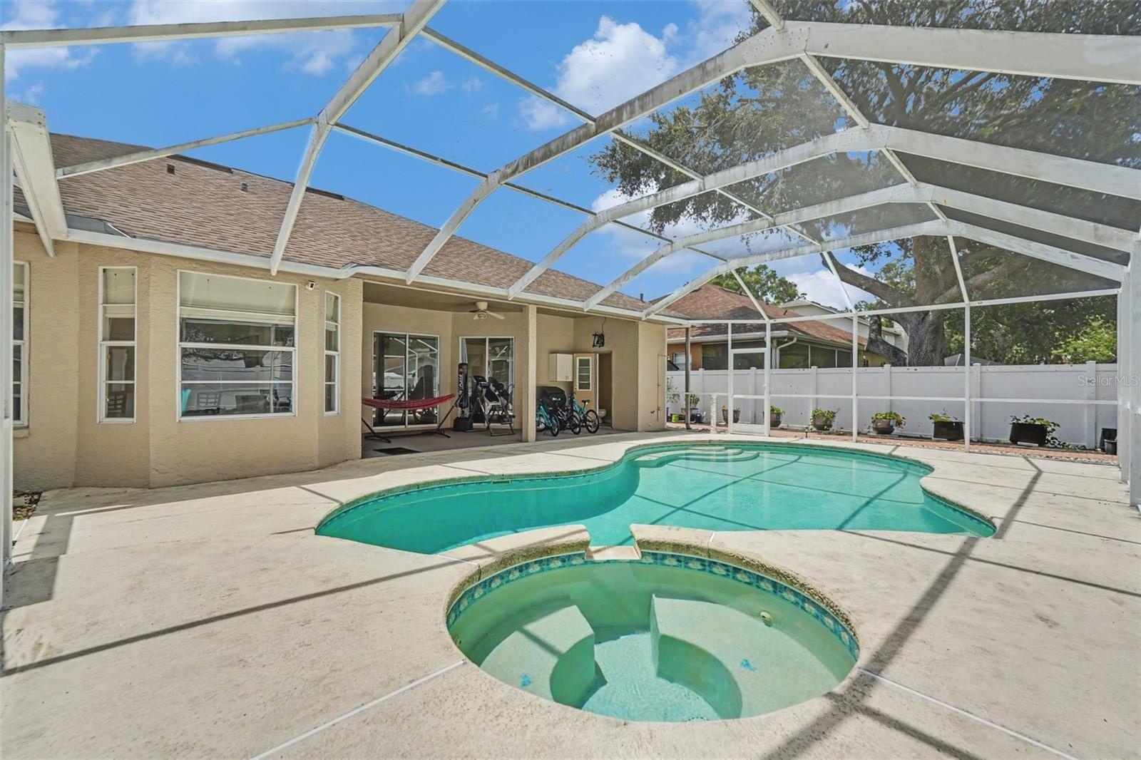 Pool/Spa with Screened Enclosure.