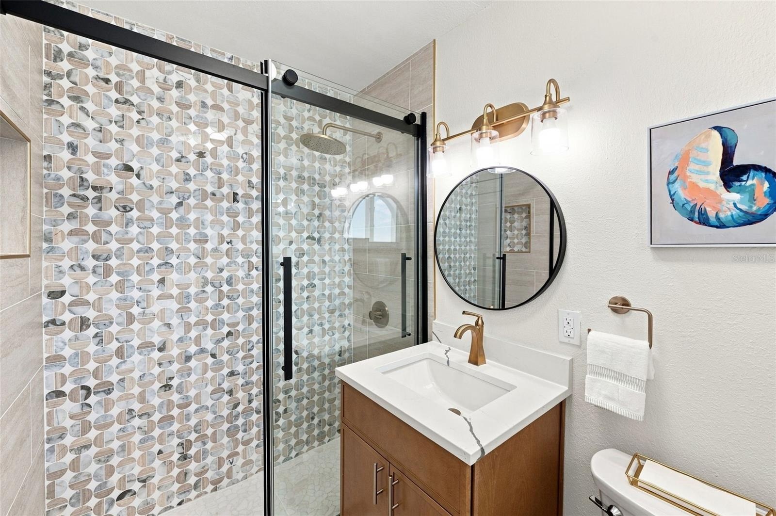 Primary bathroom with beautiful shower.