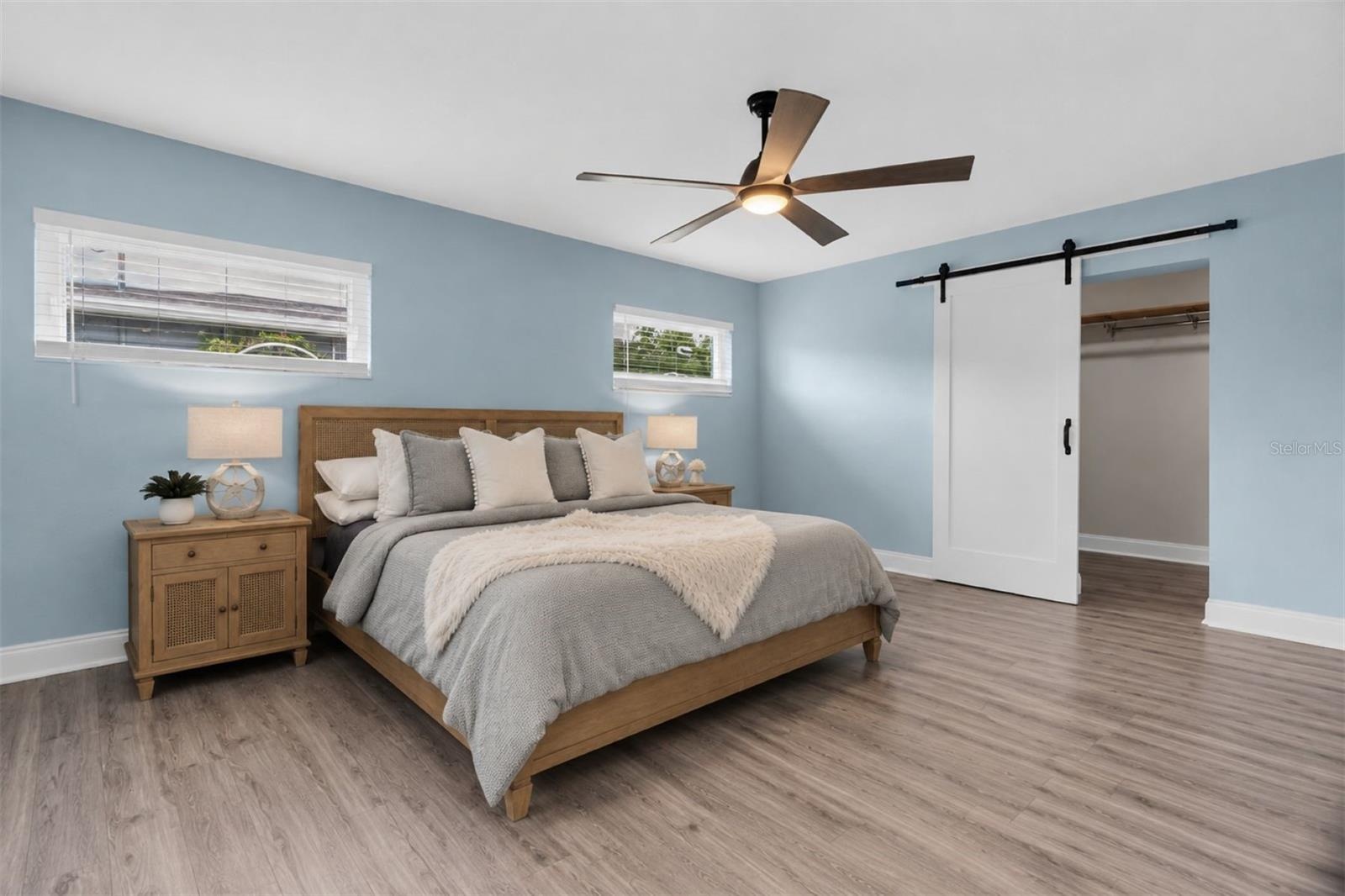 Spacious primary suite includes a large walk-in closet and a beautifully designed en-suite bath.