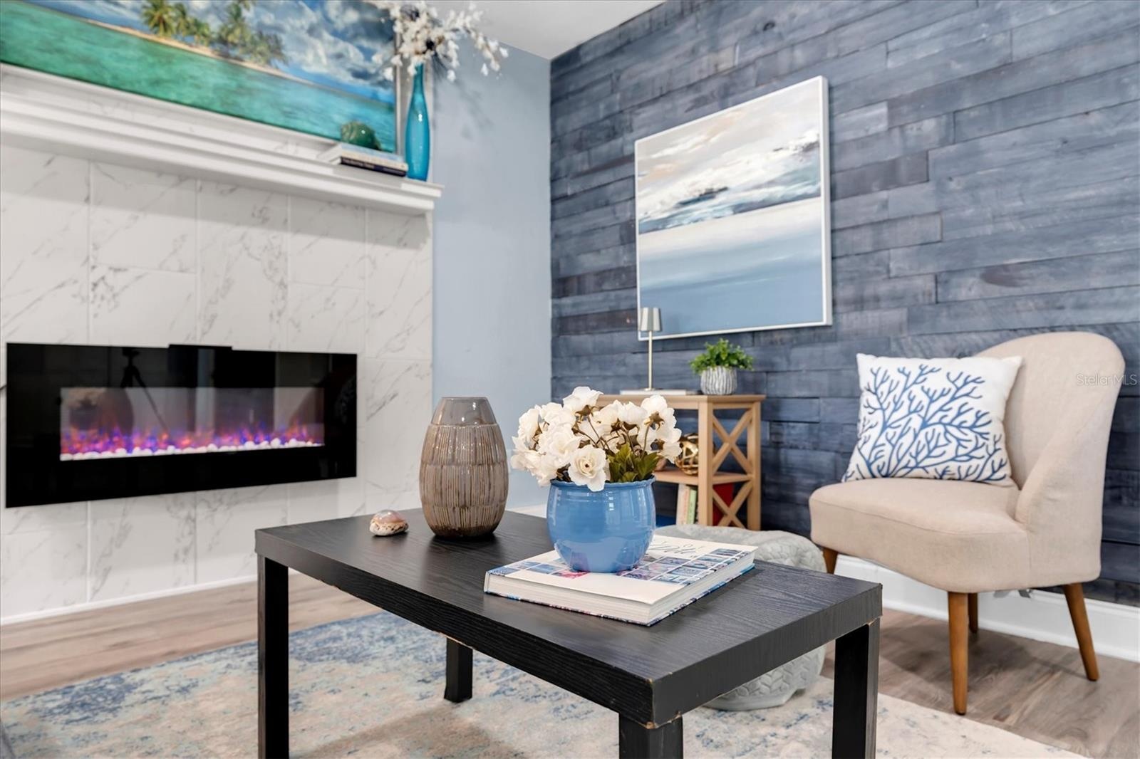 Marble-surround fireplace creates a stylish focal point for the living area.