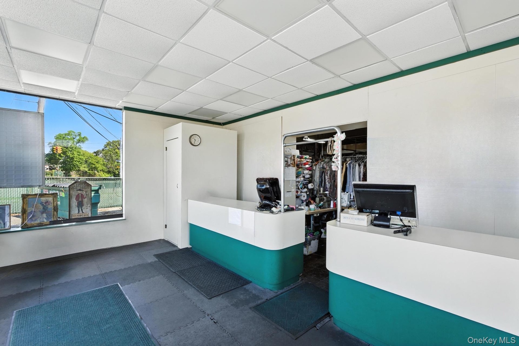 Reception area featuring pet washing station and a paneled ceiling