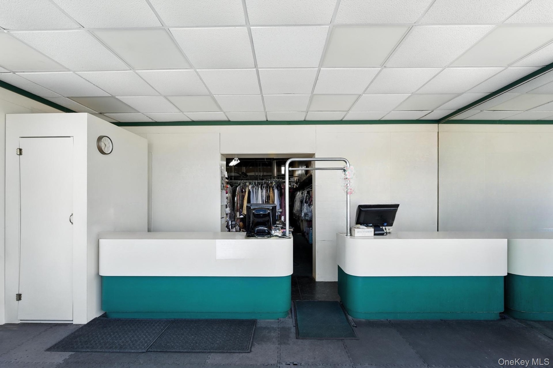 Reception featuring pet washing area and a paneled ceiling