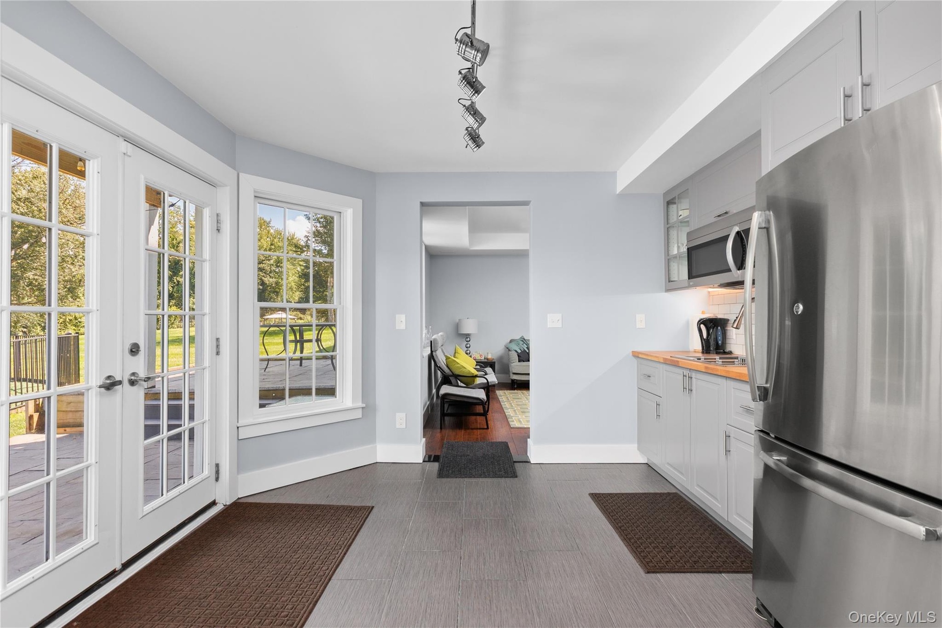 Perfectly positioned between the game room and family room, the kitchenette offers a convenient space to prepare snacks, refreshments, and barbecue ac